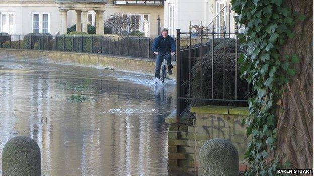 Cyclist in flood on Brigham Road in Reading