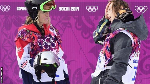 Czech Republic's Sarka Pancochova (R) speaks with Great Britain's Jenny Jones after crashing