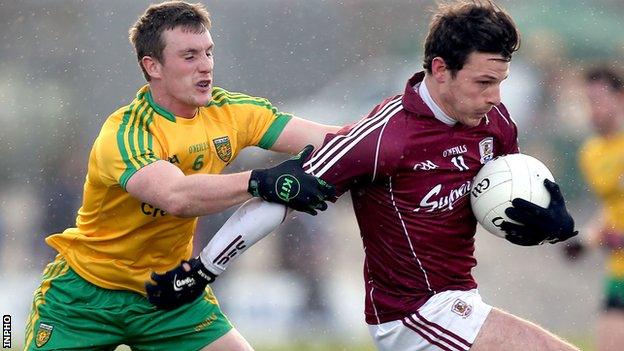 Donegal's Leo McLoone challenges Sean Armstrong of Galway