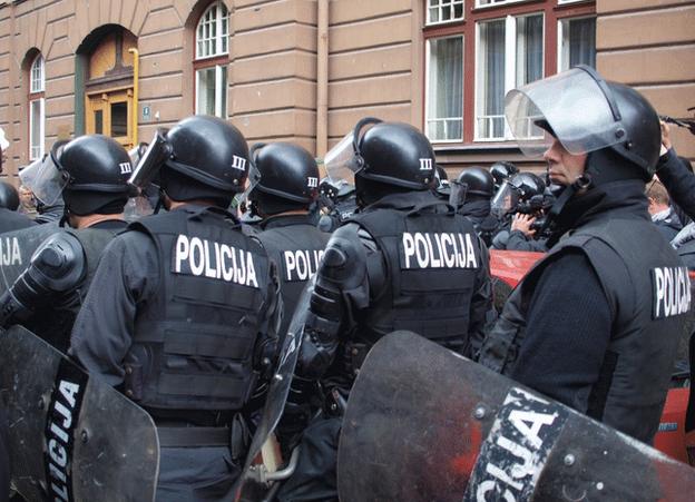 Police stand around the presidency building in Sarajevo, 9 February