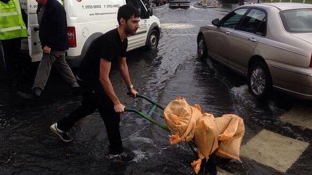 Residents in Datchet collect sandbags from a lorry