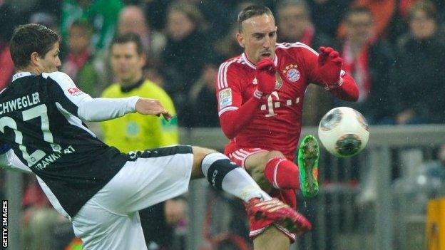 Franck Ribery (right) of bayern Munich challenges Pirmin Schwegler of Frankfurt