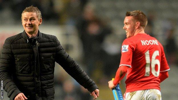 Cardiff manager Ole Gunnar Solskjaer and Craig Noone share a joke