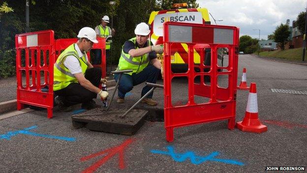 workmen doing survey work