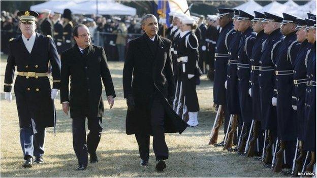 US President Barack Obama (middle) and French President Francois Hollande on the South Lawn at the White House on 11 February 2014