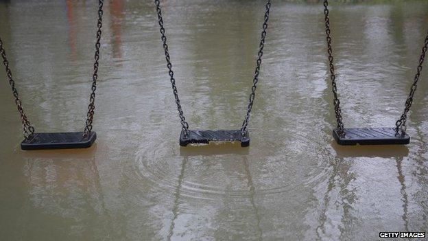 Flood water reaches a children's playground in Wraysbury