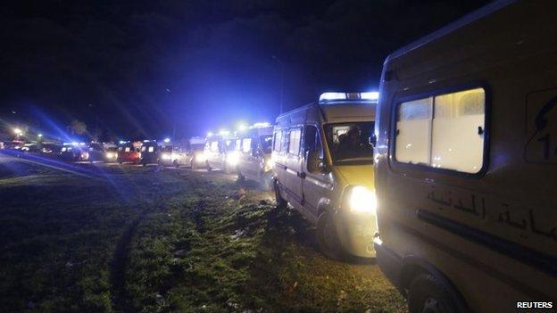 Ambulances transport the victims of a military plane crash in Oum al-Bouaghi province