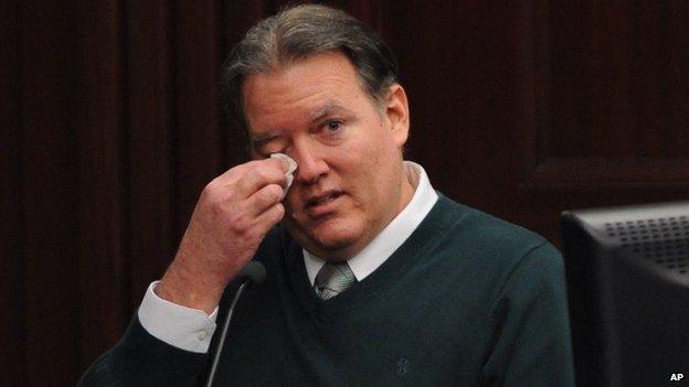 Defendant Michael Dunn reacts on the stand during testimony in his own defense during his murder trial in Duval County Courthouse in Jacksonville, Florida 11 February 2014