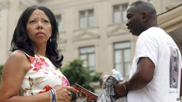 Lucy McBath, left, and her husband Ron Davis participate in a gun control rally as part of the "No More Names: National Drive to Reduce Gun Violence," in Atlanta 24 June 2013