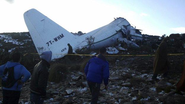 A crashed military plane is pictured in Oum El Bouaghi province, about 500km (311 miles) from the capital Algiers on 11 February 2014.