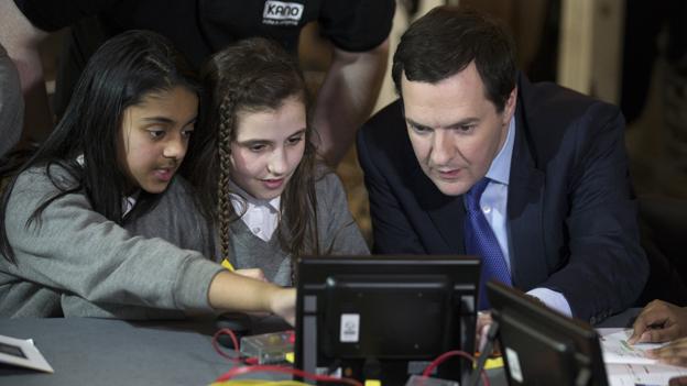 George Osbourne with two schoolgirls looking at a small computer