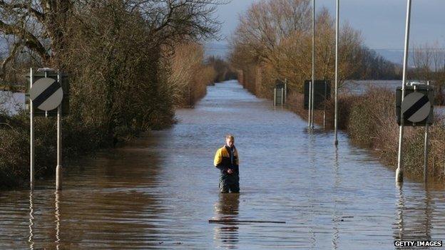 Man standing in flood water