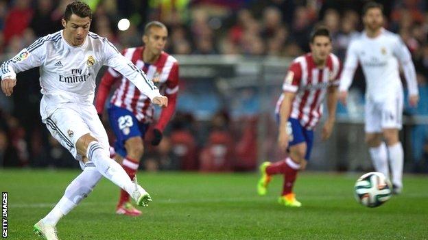 Cristiano Ronaldo of Real Madrid scores their opening goal from a penalty