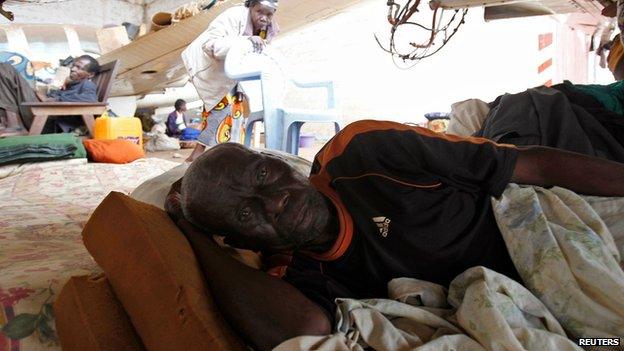 Displaced person at a camp at Bangui airport on 11 February 2014