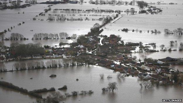 Water surrounds flooded properties in the village of Moorland on the Somerset Levels