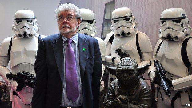 George Lucas with Stormtroopers and a statue of Yoda at the opening of ILM's facility in Singapore