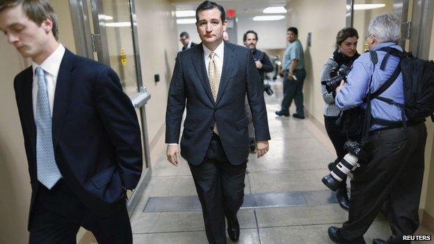 US Senator Ted Cruz walks to the Senate floor for a vote whether to raise the debt ceiling at the US Capitol in Washington 12 February 2014