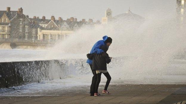 Adult and child hit by big wave