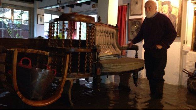 Julian Pemberton in his flooded house in Shepperton