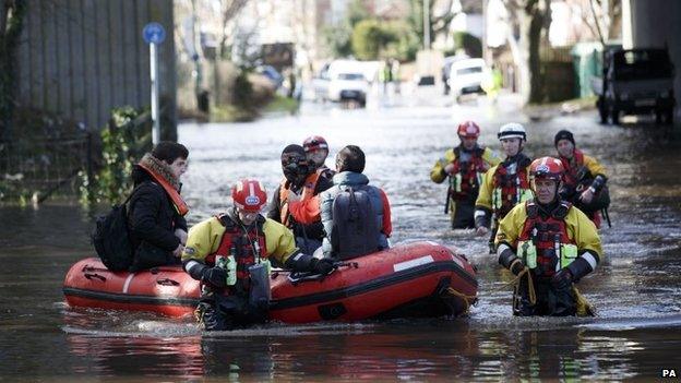 Members of the RSPCA rescue residents in Egham