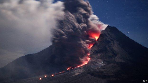 Sinabung volcano spews hot ash and lava in Karo, Indonesia on 14 January 2014