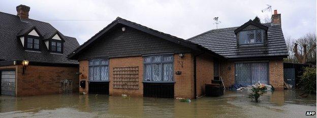 Floodwater surrounds a property in the village of Wraysbury, west of London