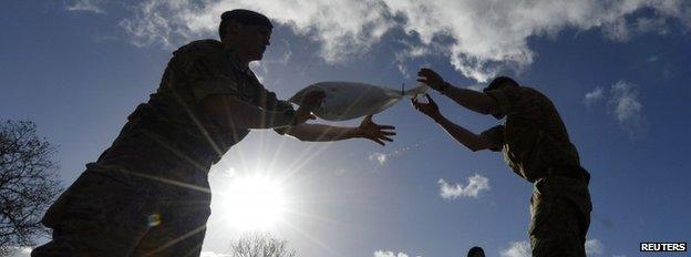 Royal Marines from 40 Commando lay sandbag water defences