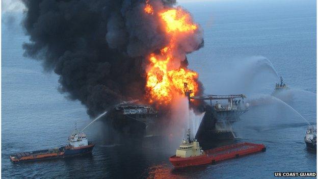 US Coast Guard file image released on April 22, 2010 shows fire boat response crews as they battle the blazing remnants of the off shore oil rig Deepwater Horizon April 21, 2010