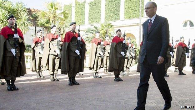 Italian PM Enrico Letta arrives at the presidential palace to hand in his resignation 14 February 2014