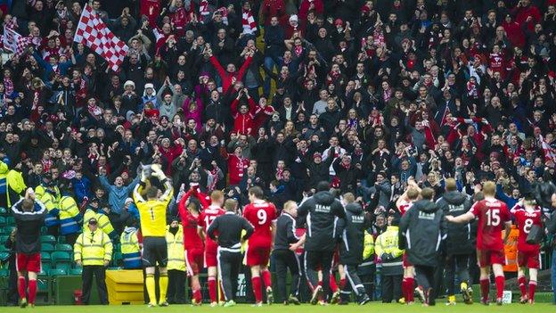 Aberdeen fans celebrate their Scottish Cup semi-final win at Celtic Park