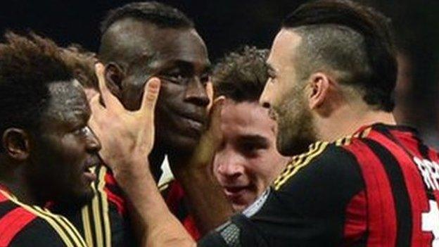 AC Milan players celebrate with goalscorer Mario Balotelli against Bologna