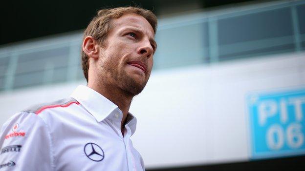 Jenson Button of Great Britain and McLaren arrives in the paddock during previews for the Indian Formula One Grand Prix at Buddh International Circuit on October 24, 2013.