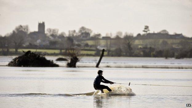 A wakeboarder rides the flood water on the Somerset Levels