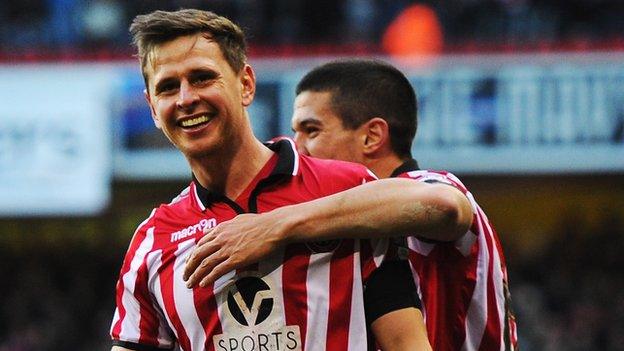 Sheffield United's Chris Porter (left0 celebrates as he helps his side to beat Nottingham Forest in the FA Cup