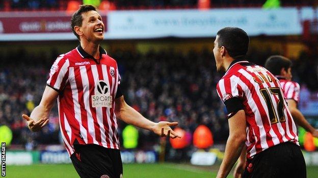 Sheffield United's Chris Porter (left) celebrates with Conor Coady as he helps his side to beat Nottingham Forest in the FA Cup