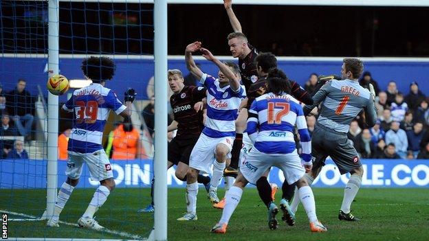 Reading's Alex Pearce scores against QPR with a header