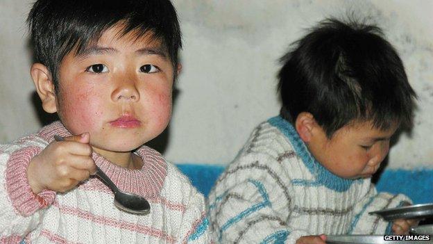 In this handout from the United Nations, North Korean boys eat lunch in a government-run nursery, on 20 April 2005 in Sariwon city, North Hwanghae province, North Korea.