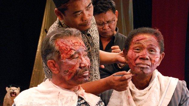 Anwar Congo (right) being made up ahead of filming a scene for The Act of Killing