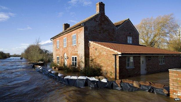 A house surrounded by flood water in Burrowbridge, Somerset