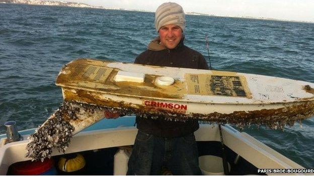 Paris Broe-Bougourd holding the 5ft unmanned boat