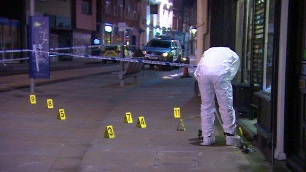 Forensics police officer outside hairdressers