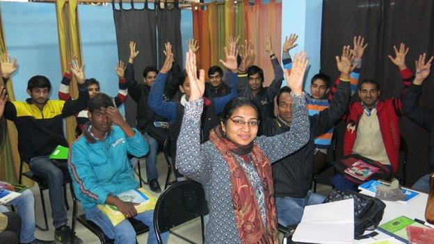 Students use the sign for "applause"