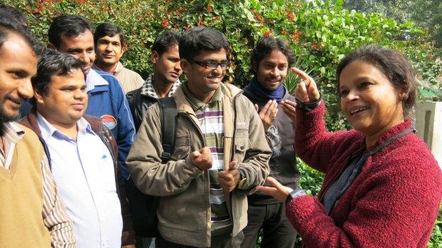 Noida Deaf Society founder Ruma Roka (right) talking to students