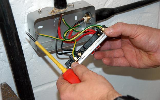 Electrician rewires socket