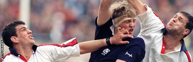 Doddie Weir (centre) vies for the ball with England second rows Martin Johnson (left) and Martin Bayfield at a line-out