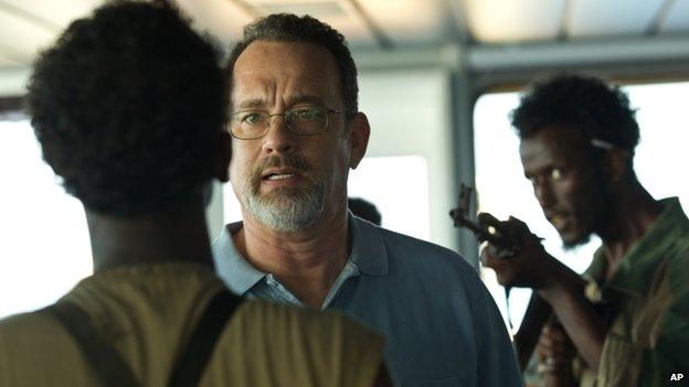 Tom Hanks (centre) is seen in a scene from the film Captain Phillips