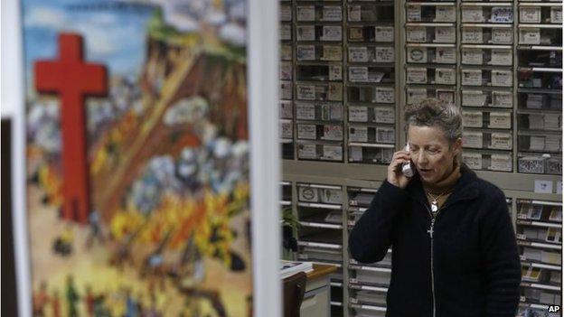 Karen Short talks on the phone inside the Christian Book Room in Hong Kong, February 19