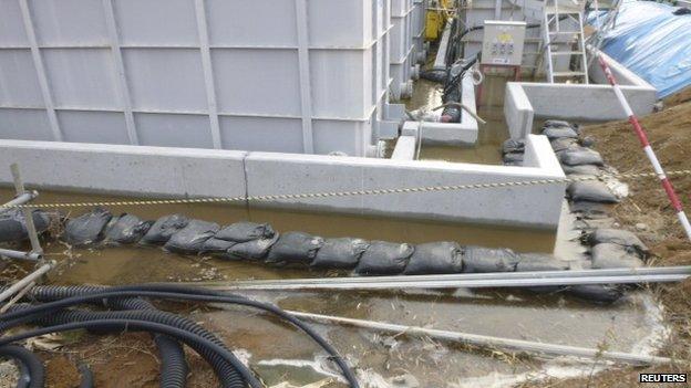 Highly contaminated water leaked from a large storage tank is seen at the H6 area of the contaminated water storage tanks, Fukushima nuclear plant, 20 February 2014