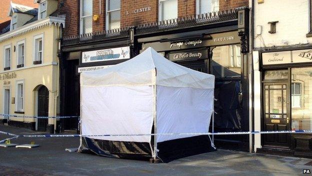 A police tent at the front of Fringe Benefits and La Bella Beauty in Southgate Street, Gloucester