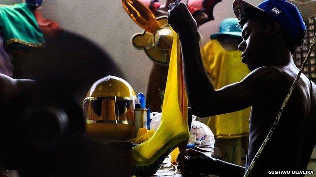 Man working on carnival costume